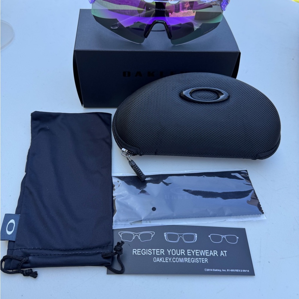 Oakley Sunglasses with Purple Lenses and Black Case